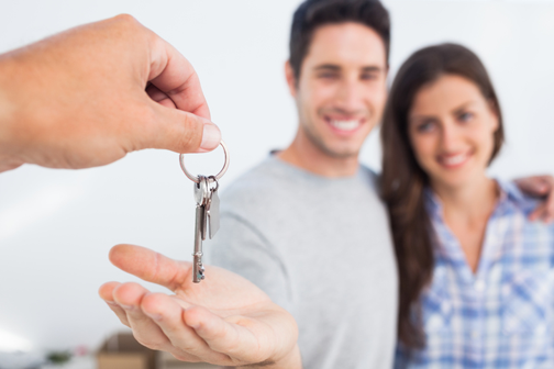 Happy Couple Getting Keys to New House