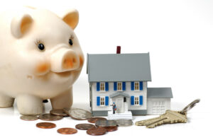 piggy bank with coins and a home